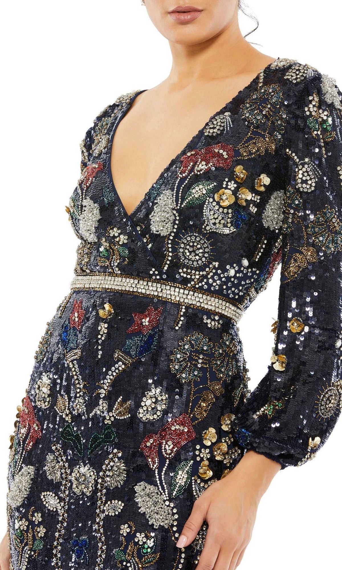 A woman wearing the Mac Duggal Long Formal Dress 93546 featuring a deep V-neck, long sleeves, and intricate multicolored sequin and bead floral embroidery.